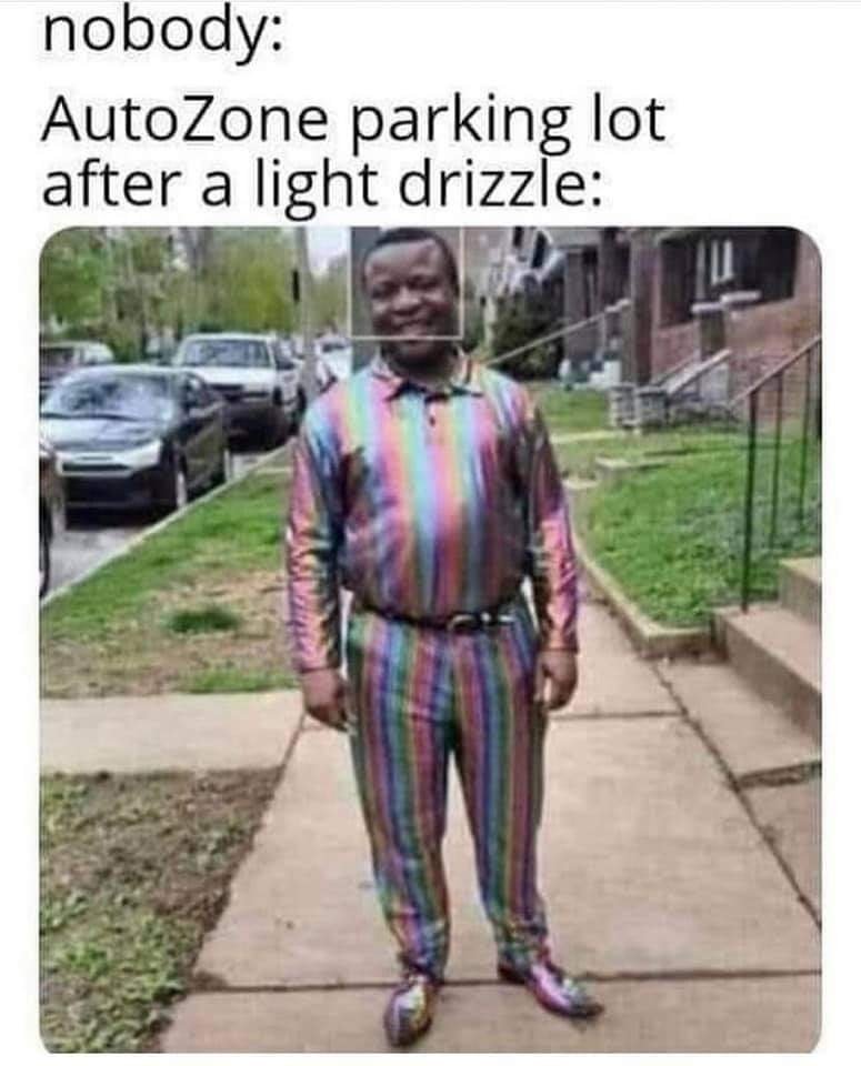 AutozoneParkingLotAfterDrizzleOilRainbowStain.jpg