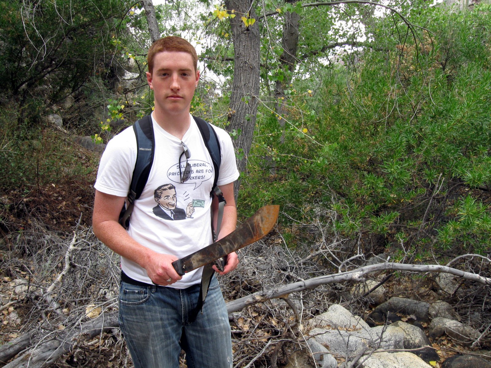 June 5 Pima Canyon Trail Brendan finds a machete in the wash.jpg