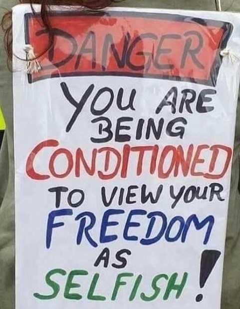 message-sign-danger-being-conditioned-view-freedom-as-selfish.jpg