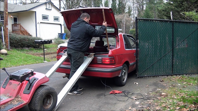 Screenshot 2024-07-25 at 16-02-25 lawn mower in back of suv at DuckDuckGo.png